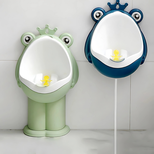 Two frog-shaped urinals, one green and one blue, on a white tiled wall.