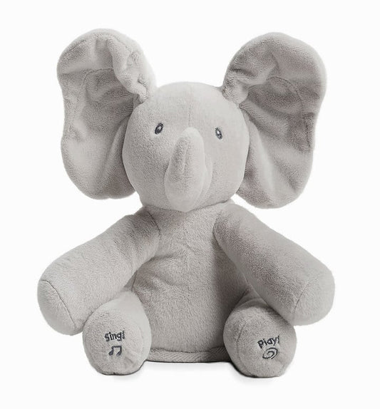Gray plush elephant toy with 'Sing' and 'Play' buttons on a white background